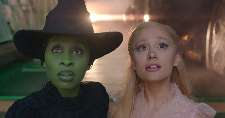 Cynthia Erivo as the green-skinned Elphaba and Ariana Grande as the pink-loving Glinda looking beyond the camera.