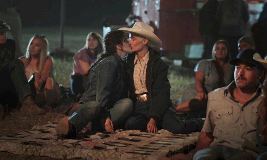 Yellowstone still: Lilli Kay and Juli Kocemba kissing on a picnic blanket