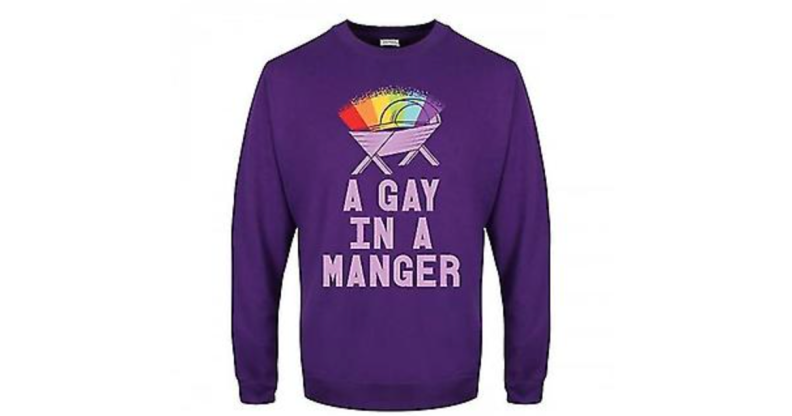 A purple Christmas jumper with a rainbow over a crib and the text 'a gay in a manger' from Debenhams