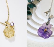 A gold violet necklace with a violet shaped charm and a violet coloured charm on the chain and a necklace of a dried violet flower sealed in resin.