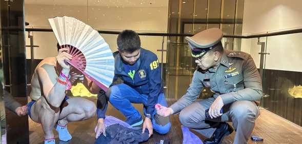 A man being questioned by Thonglor Police Station officers