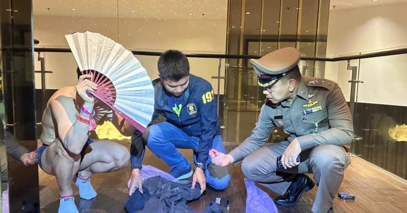 A man being questioned by Thonglor Police Station officers