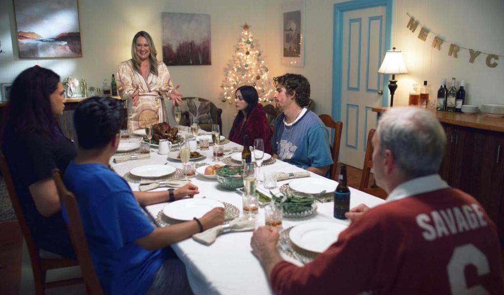 A Savage Christmas still: a family sat around the Christmas table, all looking miserable.