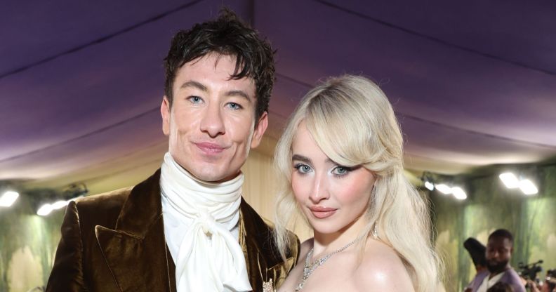 Barry Keoghan and Sabrina Carpenter pose together smiling in May 2024