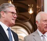 Britain's King Charles III stands with Britain's prime minister Keir Starmer.