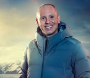 Rob Rinder in a thermal jacket with a mountain backdrop