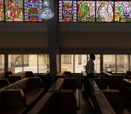 A man walks through the bench of the Methodist Church of the Trinity in Lagos on February 19, 2023 (Getty)