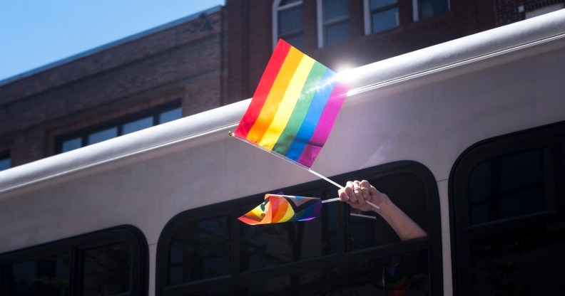 Pride flag waving out of a bus in Oregon