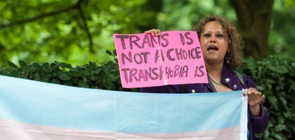 A group of demonstrators gather in front of the US Embassy to protest against Donald Trump's latest announcement that transgender troops will not be allowed to serve in any capacity in the US military on July 28, 2017 in London, England.