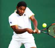 Joao Lucas Reis Da Silva of Brazil plays a backhand in his Boys' Singles first round match on day seven of the Wimbledon Lawn Tennis Championships at All England Lawn Tennis and Croquet Club on July 9, 2018 in London, England.