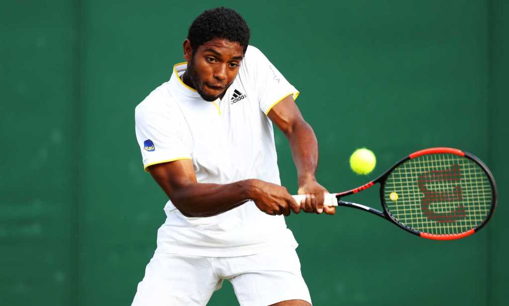 Joao Lucas Reis Da Silva of Brazil plays a backhand in his Boys' Singles first round match on day seven of the Wimbledon Lawn Tennis Championships at All England Lawn Tennis and Croquet Club on July 9, 2018 in London, England.