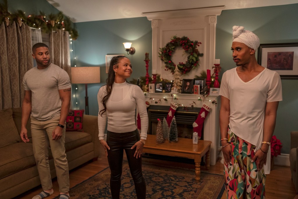 Meet Me Next Christmas; two men and a woman in the middle in a christmas decorated lounge about to dance