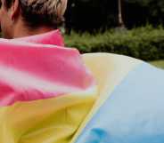 person holding a pansexual flag