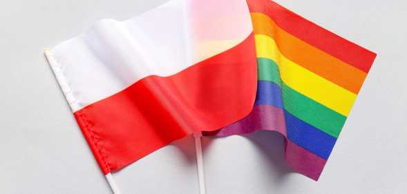 a polish flag and an LGBTQ+ flag