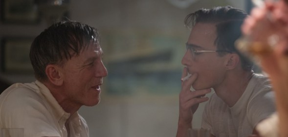 Daniel Craig as Lee facing Drew Starkey's Eugene smoking.