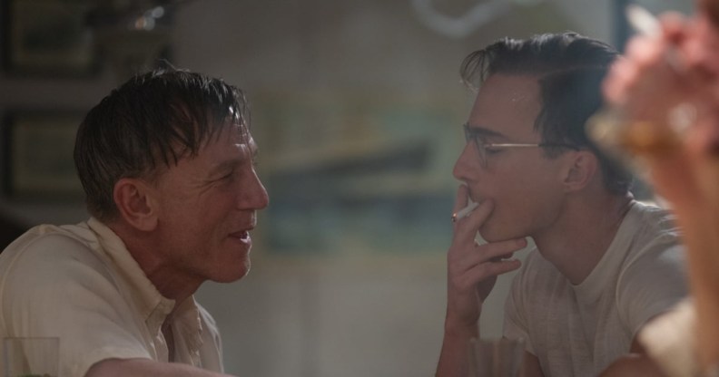 Daniel Craig as Lee facing Drew Starkey's Eugene smoking.