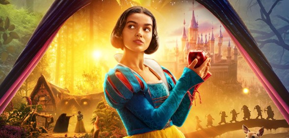 Rachel Zegler as Snow White in Disney's live action film poster, holding a red apple