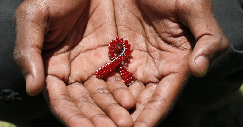 beaded AIDS symbol in hands