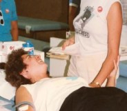 woman giving blood during AIDS crisis