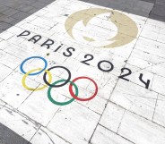 Olympics rings logo and 'Paris 2024' text on the ground