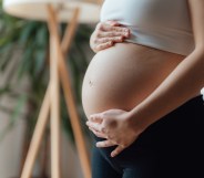 woman with a baby bump after fertility treatments