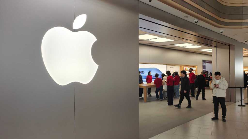 Consumers shop for the iPhone 16 series at the flagship store of Apple Smart Products on Nanjing Road Pedestrian Street in Shanghai, China