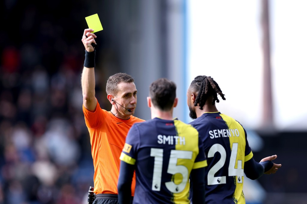 BURNLEY, ENGLAND - MARCH 03: Referee David Coote shows a yellow card to Antoine Semenyo of AFC Bournemouth during the Premier League match between Burnley FC and AFC Bournemouth at Turf Moor on March 03, 2024 in Burnley, England. (Photo by Alex Livesey/Getty Images)