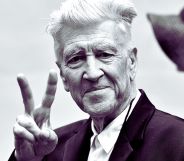 David Lynch throwing a peace symbol.