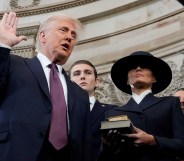 Donald Trump is sworn in as US president by Supreme Court Chief Justice John Roberts during inauguration ceremonies in the Rotunda of the Capitol on January 20, 2025 in Washington, DC, as his wife Melania Trump and son Barron Trump look on. Trump takes office for his second non-consecutive term as the 47th president of the United States. (Photo by Morry Gash / POOL / AFP)