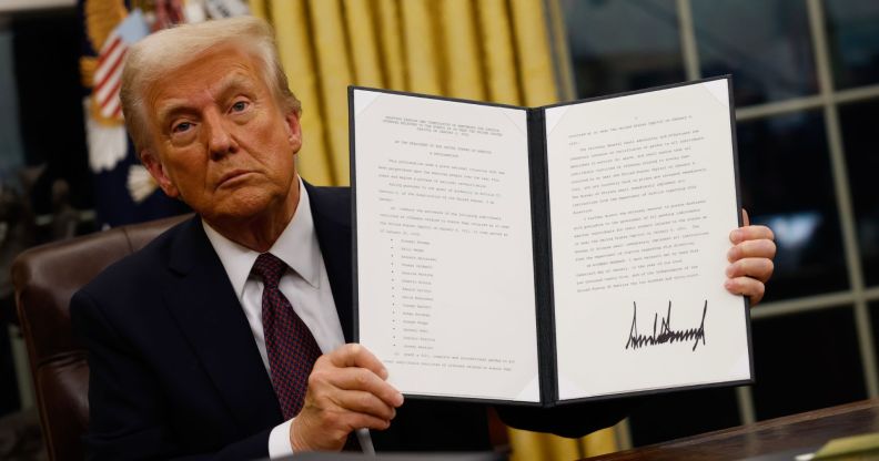 US President Donald Trump holding up an executive order after his inauguration on Monday 20 January 2025