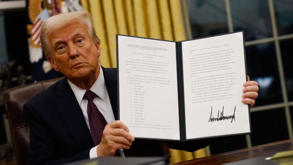 US President Donald Trump holding up an executive order after his inauguration on Monday 20 January 2025