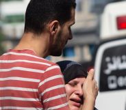 A person comforting a loved one in the Gaza Strip