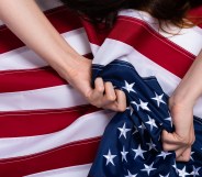 Woman holding US flag.