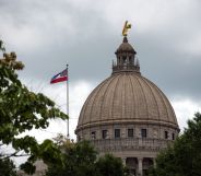 The state flag flies over the Mississippi State Capitol building in Jackson, Mississippi on June 29, 2020.