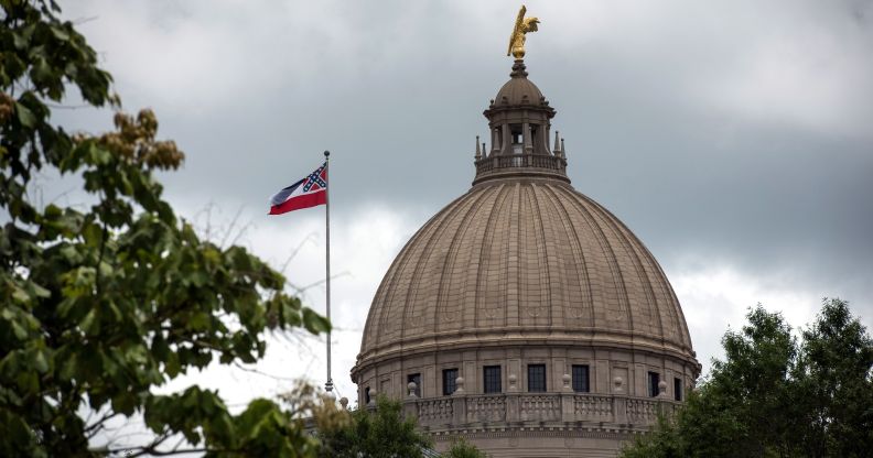 The state flag flies over the Mississippi State Capitol building in Jackson, Mississippi on June 29, 2020.