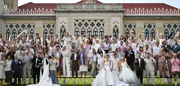 Couples and members of LGBTQ community pose for photos to promote "Marriage Equality Day" at the Government House in Bangkok on January 15, 2025.