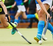 A close-up of a field hockey game.