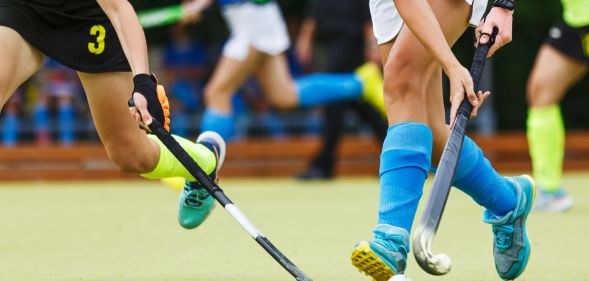 A close-up of a field hockey game.