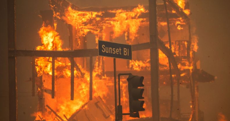 Image of a road sign reading "Sunset Boulevard" seen during devastating wildfires in LA, California