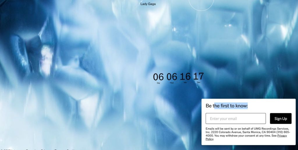 A screenshot from Lady Gaga's website featuring a countdown clock against icy blue diamonds