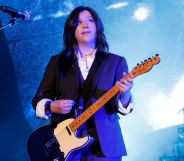 Musician Lucy Dacus performs on stage with an electric guitar