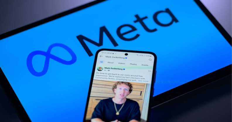 An image showing a screen with Meta's logo on it and a phone on top of it with an image of its founder, Mark Zuckerberg.