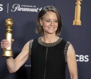 Jodie Foster holding a Golden Globe award