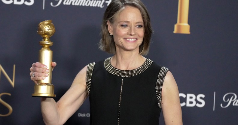 Jodie Foster holding a Golden Globe award