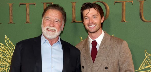 Arnold Schwarzenegger and his son Patrick smile and pose together at the premiere of The White Lotus season 3.