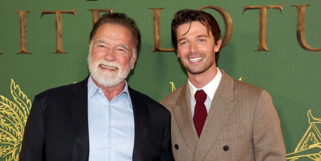 Arnold Schwarzenegger and his son Patrick smile and pose together at the premiere of The White Lotus season 3.