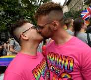 Two men kiss during the Budapest Pride Parade in Budapest, Hungary on June 22, 2024.