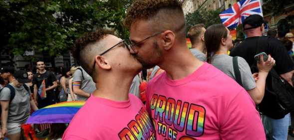 Two men kiss during the Budapest Pride Parade in Budapest, Hungary on June 22, 2024.