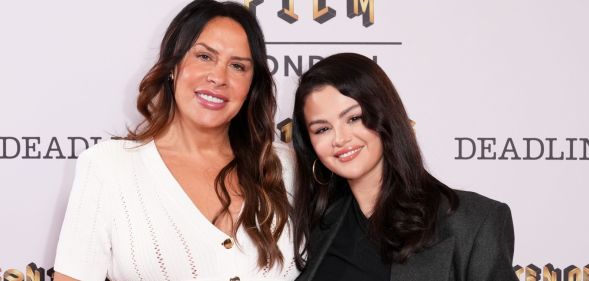 Emilia Pérez co-stars, Karla Sofía Gascón and Selena Gomez smile and pose together at a red carpet event in October 2024.