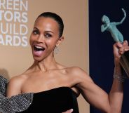 Emilia Pérez star Zoë Saldaña beams and holds up her award after winning the Best Supporting Actress SAG Award.